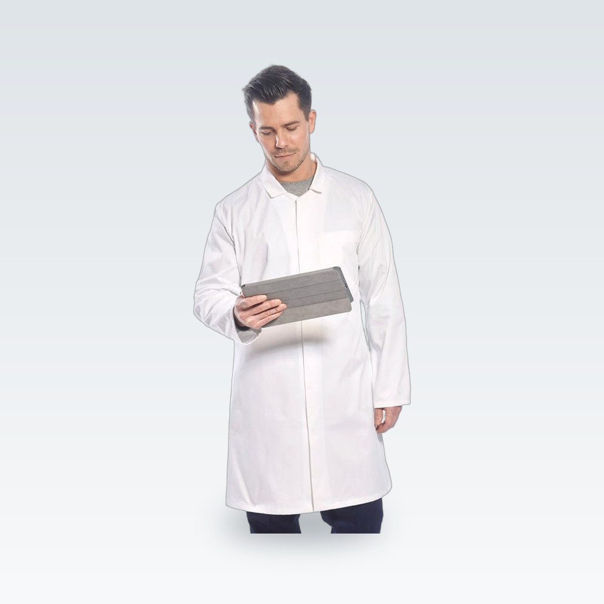 A white work coat worn over trousers