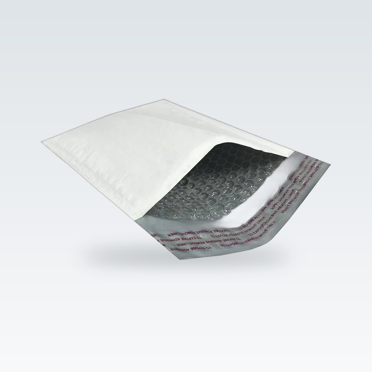 A white bubble mailer opened to show the bubble lining